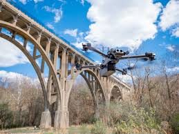 Drone inspecting a concrete arch bridge